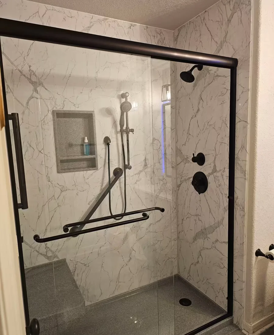 After: Santorini White walk-in shower with Venetian Bronze fixtures