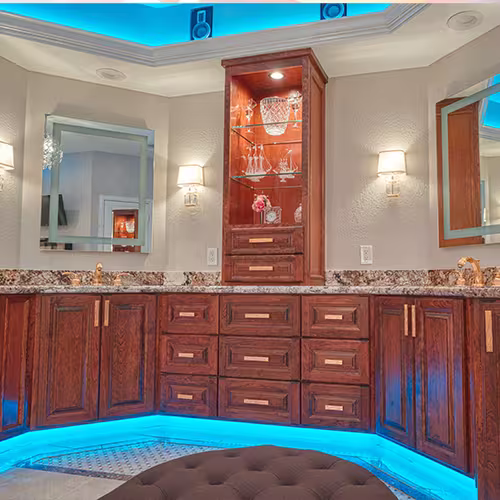 Cherry wood vanity with blue LED lighting