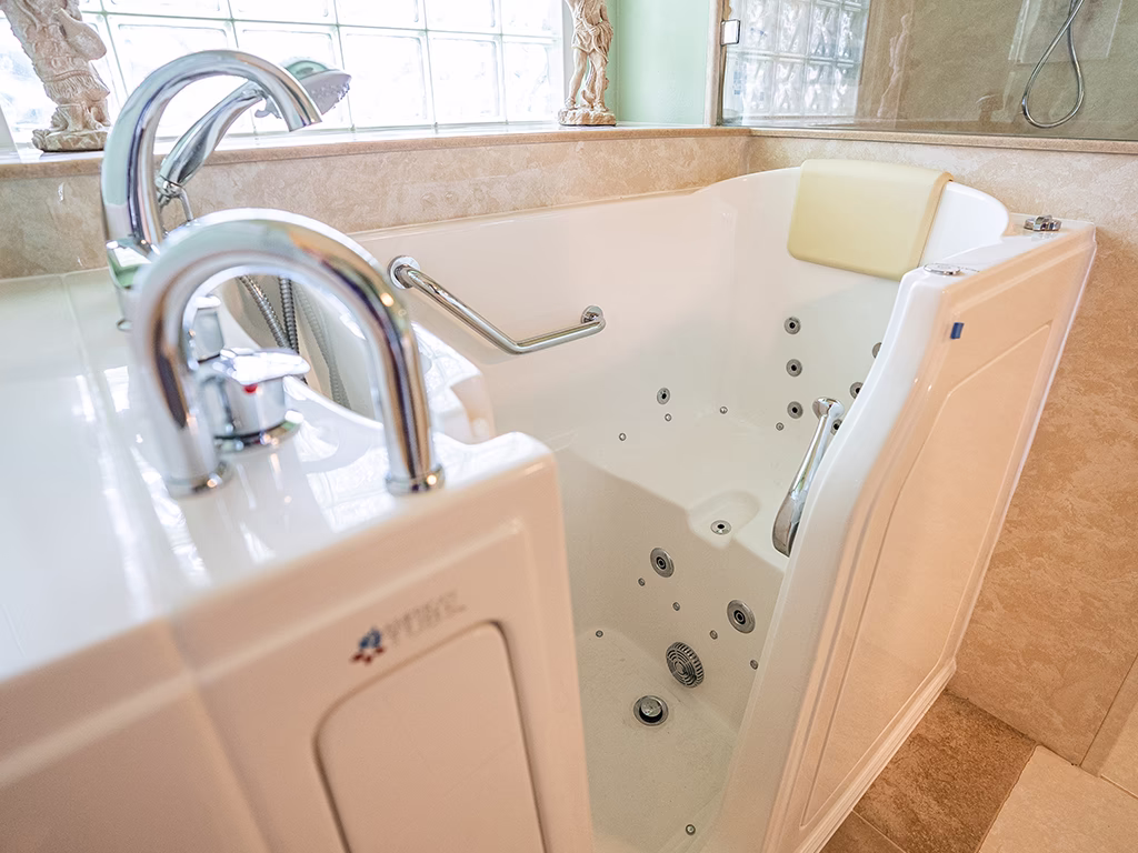 Walk-in bathtub with safety grab bars and hydrotherapy jets