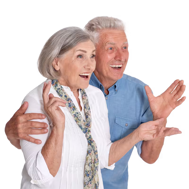 Happy senior couple smiling and gesturing with excitement during a positive customer review