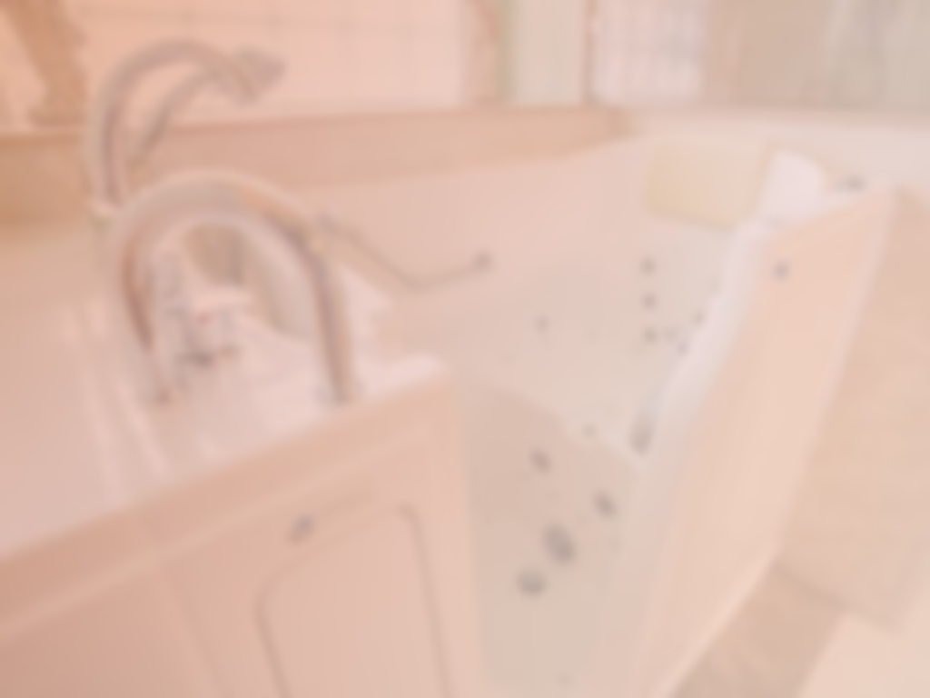Close-up of a white jetted bathtub.
