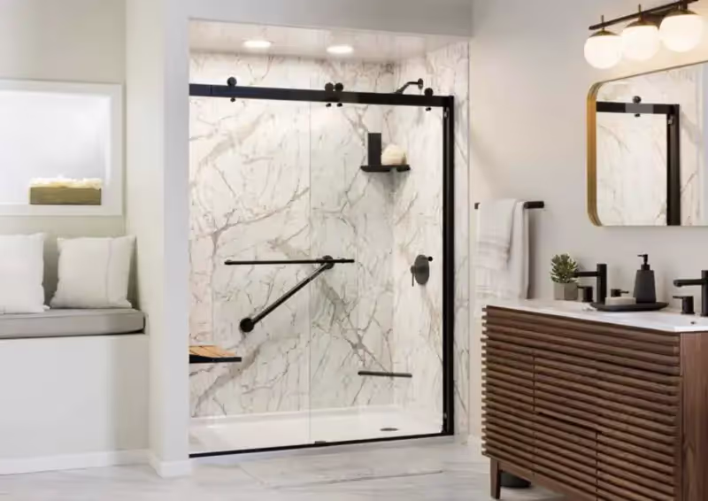 Elegant marble shower with matte black barn-style sliding door hardware.