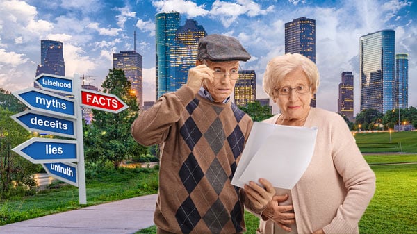 Senior Couple Reviewing Documents Outdoors