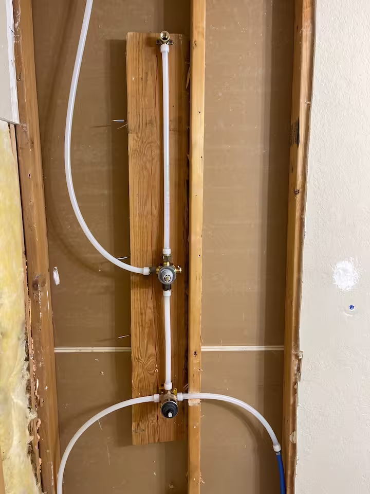 Shower plumbing upgrade with PEX lines in Houston bathroom remodel