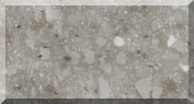 Gray terrazzo stone texture with white flecks.
