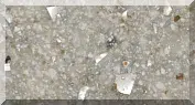 Close-up of a concrete surface with scattered debris.