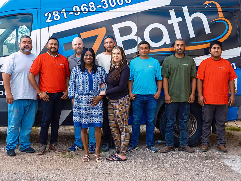 EZ Bath remodeling team standing in front of branded company van in Houston