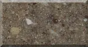 Close-up of textured brown stone surface.
