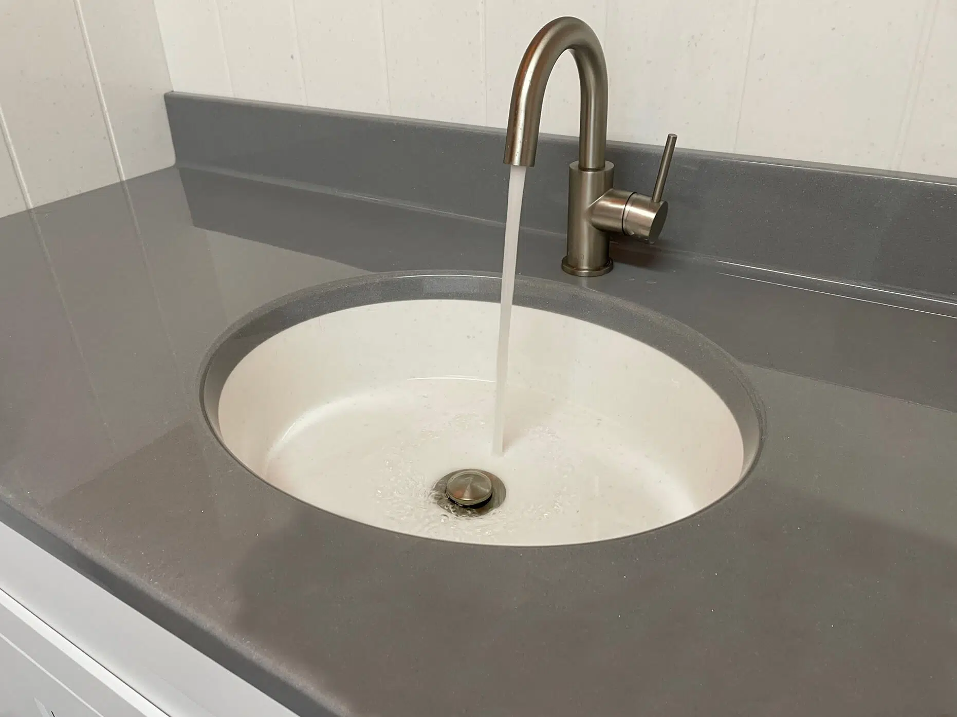 Modern sink and faucet with running water