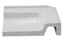 Gray marble soap dish with drainage slot.