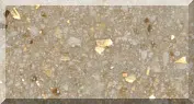 Close-up of a sandy textured surface with flecks.